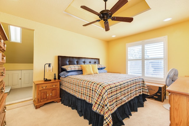 bedroom featuring light colored carpet and ceiling fan