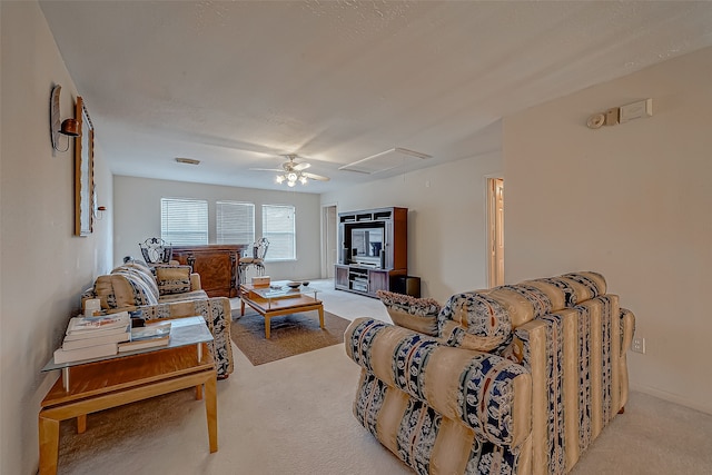 living room featuring ceiling fan and light carpet