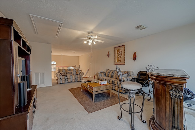 living room with light carpet and ceiling fan