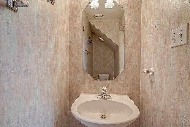 bathroom with toilet and sink