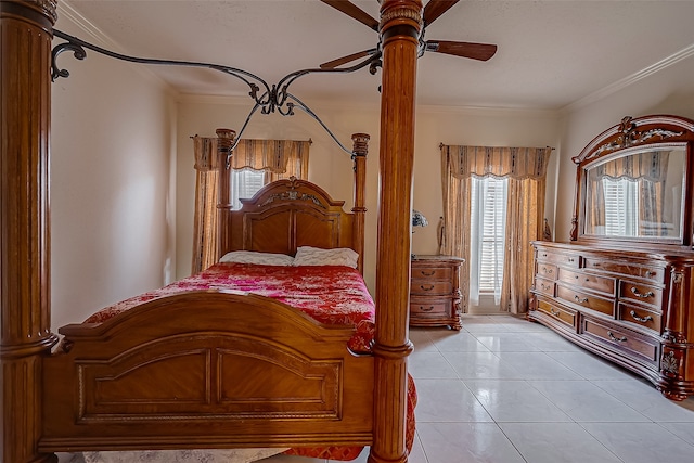 bedroom with ceiling fan, light tile patterned flooring, and crown molding