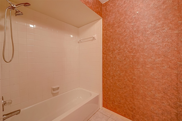 bathroom featuring tile patterned flooring and tiled shower / bath combo