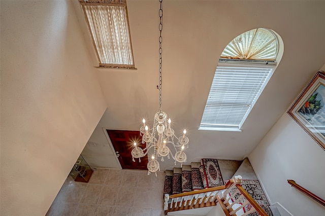 room details with tile patterned flooring and a chandelier