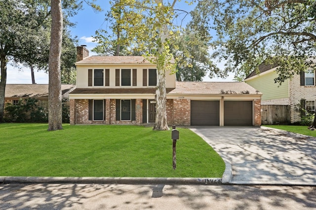 view of front of home with a front lawn and a garage