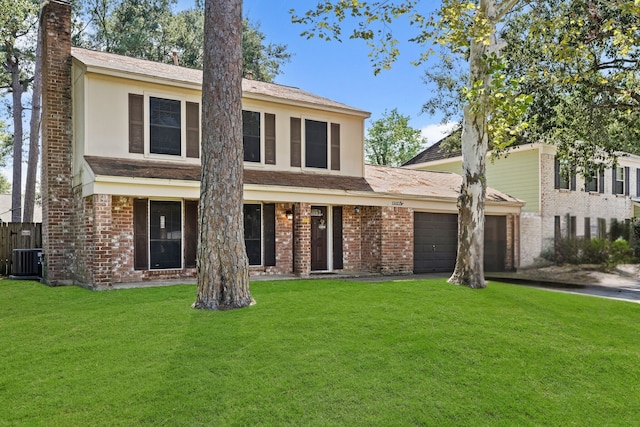 view of front of property with a front lawn and a garage