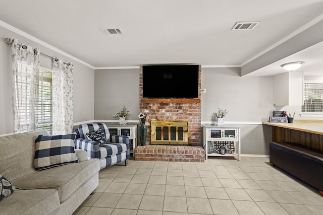 living room with ornamental molding, light tile patterned floors, and a fireplace