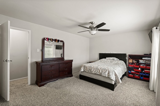 bedroom featuring light carpet and ceiling fan