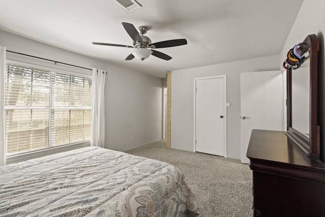 bedroom with light colored carpet and ceiling fan