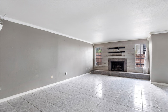 unfurnished living room with a fireplace, crown molding, and light tile patterned floors