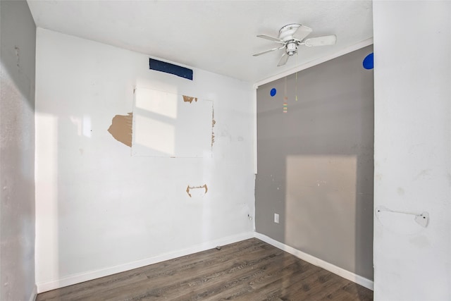 unfurnished room featuring ceiling fan and dark hardwood / wood-style flooring