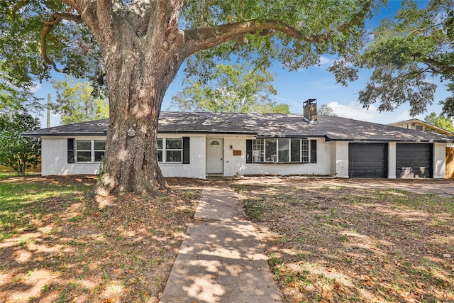 ranch-style home featuring a garage