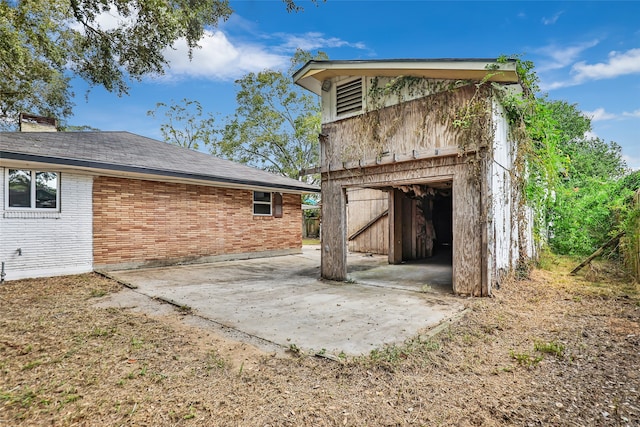 back of property with a patio area