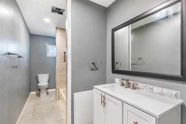 bathroom featuring vanity, toilet, and tile patterned floors