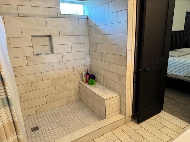 bathroom with tile patterned floors and a shower with shower curtain