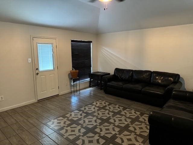 living room featuring lofted ceiling, hardwood / wood-style floors, and ceiling fan