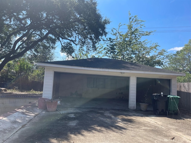 detached garage with fence