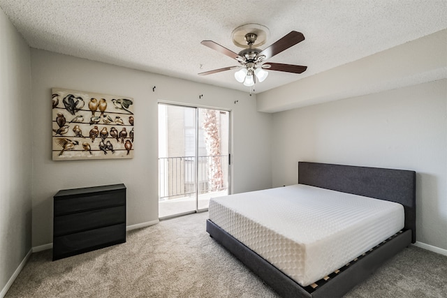 bedroom with ceiling fan, carpet floors, a textured ceiling, and access to outside