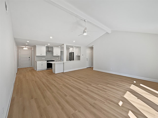 unfurnished living room with lofted ceiling with beams, light hardwood / wood-style floors, and ceiling fan