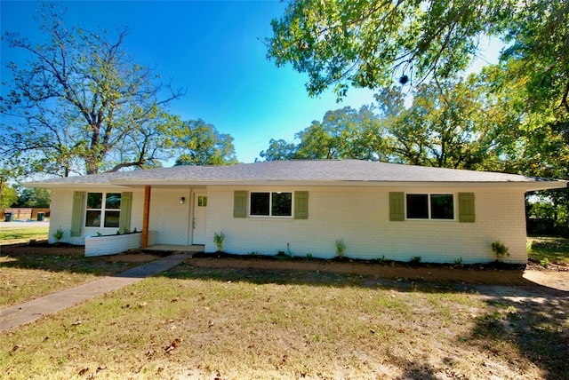 ranch-style house with a front yard