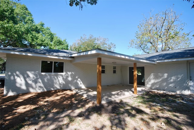 316 N Penn, Flatonia, TX 78941 - rear view of property with brick siding and an attached carport