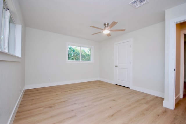 unfurnished room with light wood-type flooring and ceiling fan