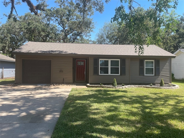 ranch-style home with a garage and a front lawn