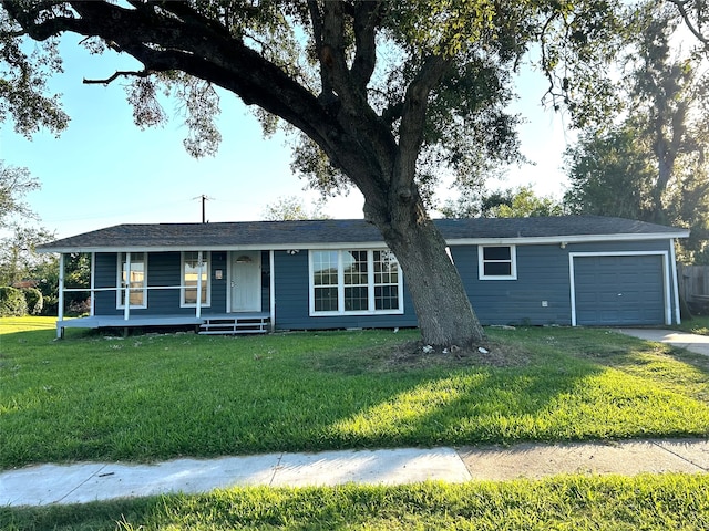 ranch-style home with a front yard, a garage, and a porch