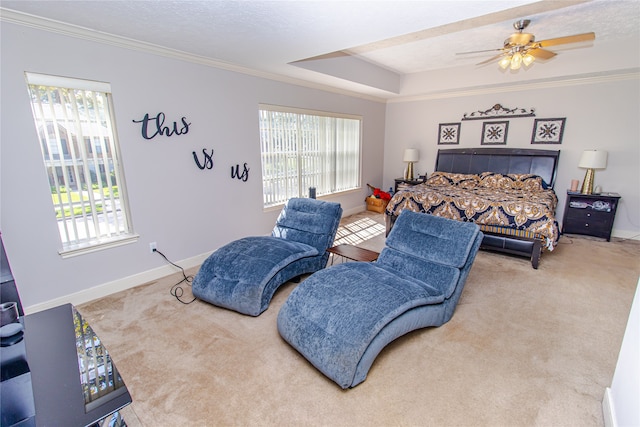 carpeted bedroom featuring a textured ceiling, ceiling fan, and crown molding