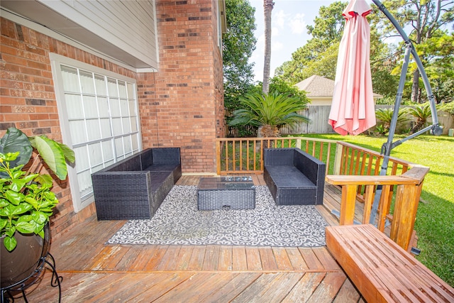 deck featuring an outdoor living space and a lawn