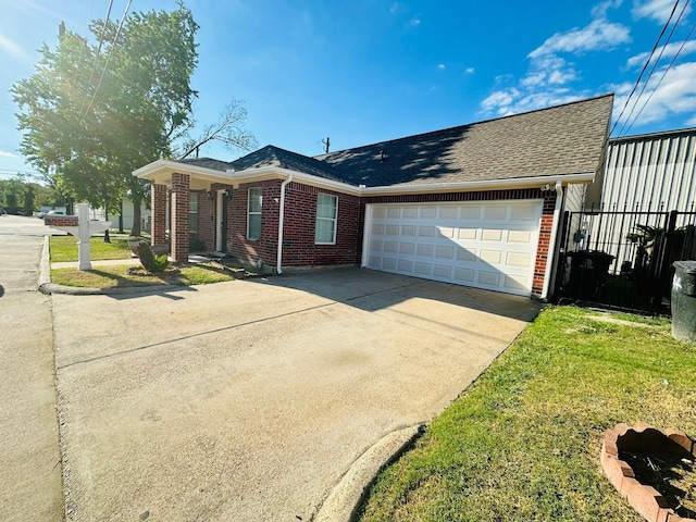 single story home featuring a front yard and a garage