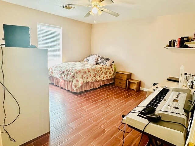 bedroom featuring wood-type flooring and ceiling fan