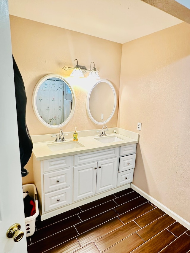 bathroom featuring vanity and hardwood / wood-style flooring