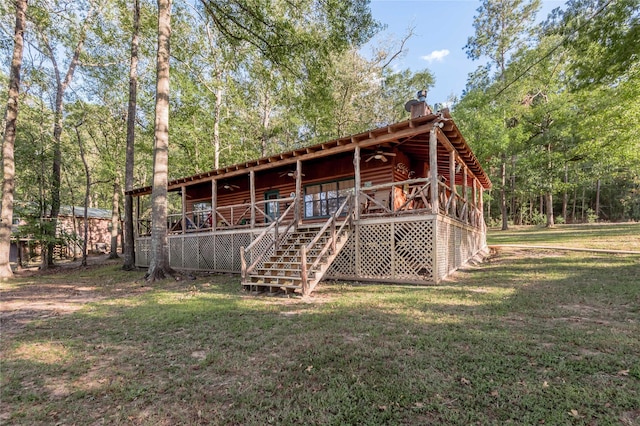 view of outdoor structure featuring a forest view and stairway