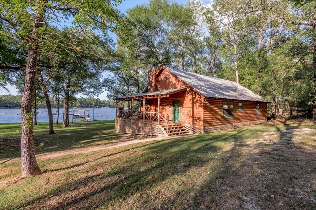 exterior space with a water view