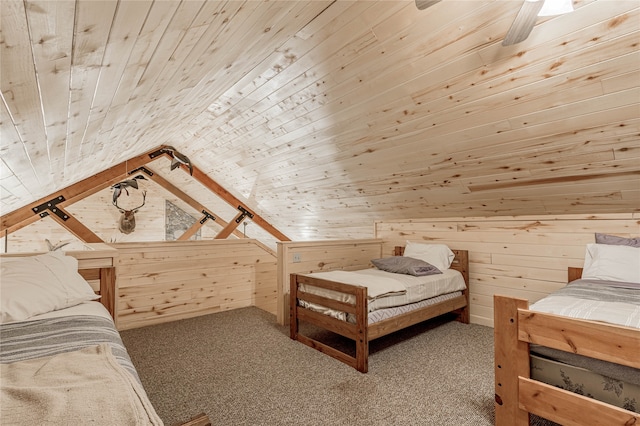 bedroom featuring carpet flooring, wood walls, vaulted ceiling, and wooden ceiling