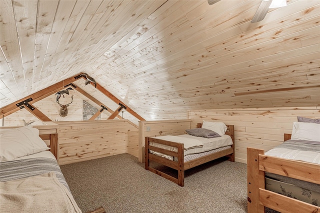 bedroom featuring vaulted ceiling, wood walls, carpet flooring, and wood ceiling