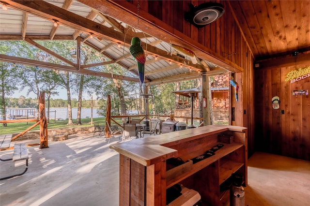 view of patio / terrace featuring a water view, ceiling fan, and a gazebo