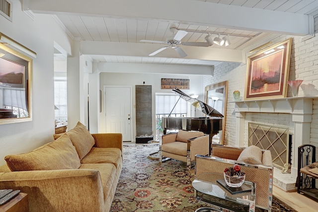 living room with wood ceiling, a brick fireplace, beamed ceiling, light wood-type flooring, and ceiling fan