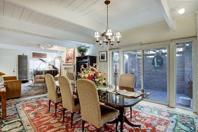 dining room with a healthy amount of sunlight, wood ceiling, ceiling fan with notable chandelier, and beamed ceiling