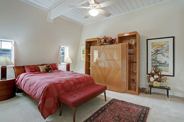 carpeted bedroom with ceiling fan, crown molding, beam ceiling, and wooden ceiling