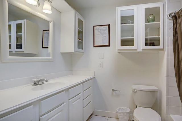 bathroom featuring a shower with shower curtain, tile patterned flooring, vanity, and toilet