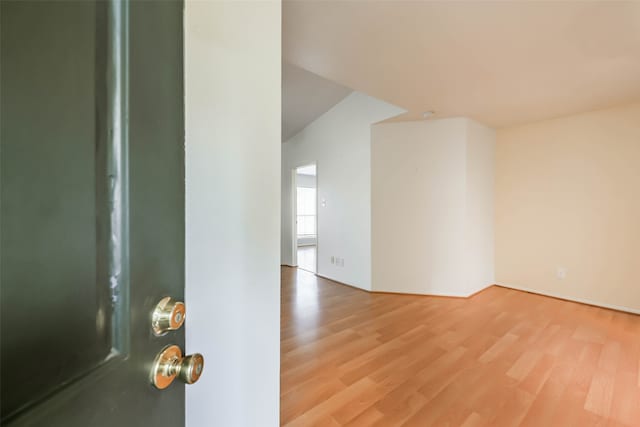 empty room with wood-type flooring