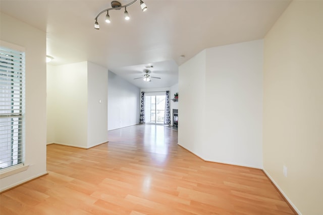 spare room with ceiling fan and light hardwood / wood-style flooring