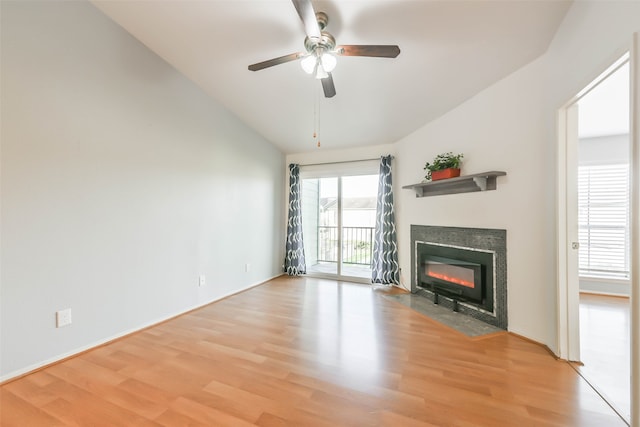 unfurnished living room featuring light wood-type flooring, lofted ceiling, and ceiling fan