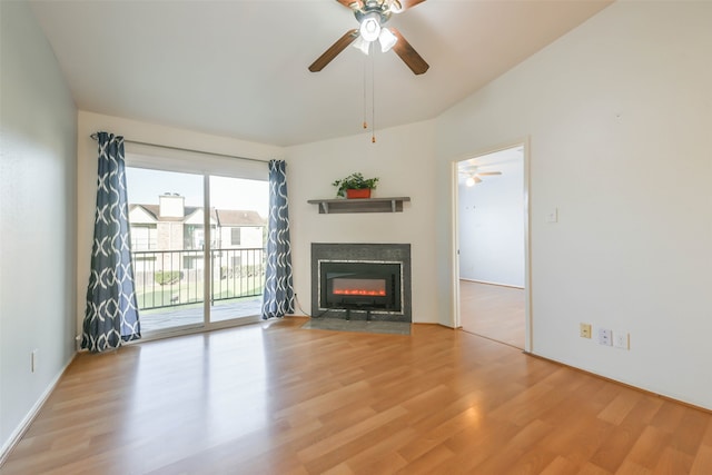 unfurnished living room with ceiling fan and light hardwood / wood-style floors