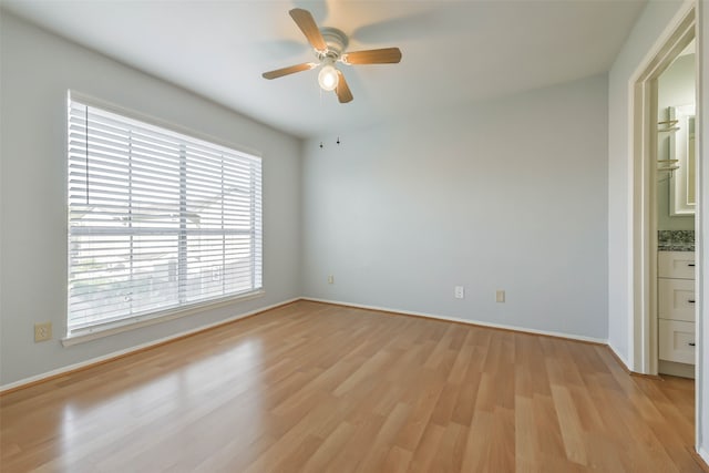 unfurnished room featuring ceiling fan and light wood-type flooring