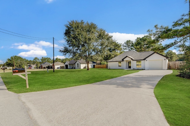 view of front facade with a front yard and a garage