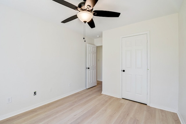 unfurnished bedroom with ceiling fan and light hardwood / wood-style floors