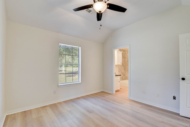 unfurnished room featuring ceiling fan, light wood-type flooring, and vaulted ceiling