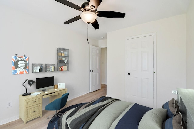 bedroom with ceiling fan and light hardwood / wood-style flooring